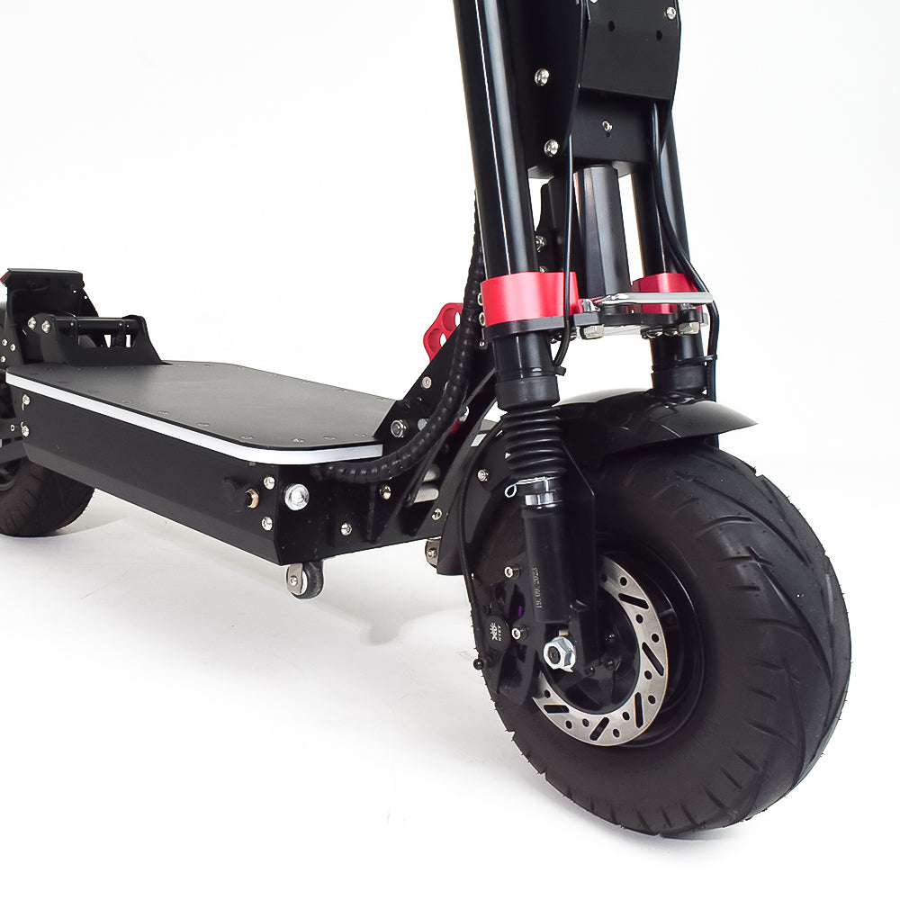 A close-up view of the front wheel and suspension system of an electric scooter, emphasizing the heavy-duty shock absorbers and durable design, suitable for off-road adventures.