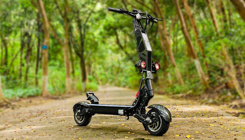 An off-road electric scooter parked on a dirt path in a dense forest, showcasing its rugged build and suitability for adventurous rides.