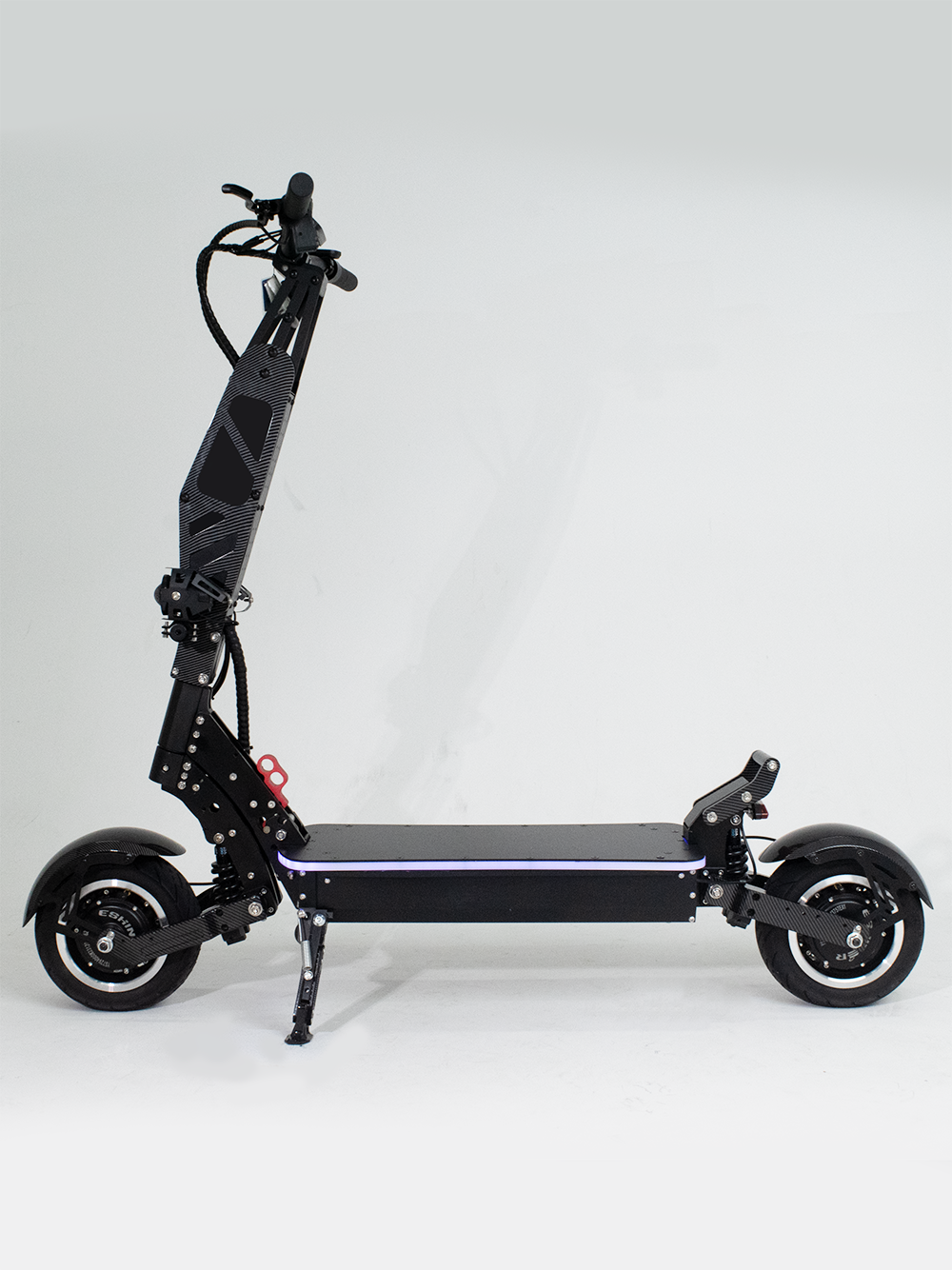 A side profile of a black electric scooter with a minimalist design, suitable for both urban commuting and off-road adventures. The scooter features a large deck and sturdy frame for enhanced stability.