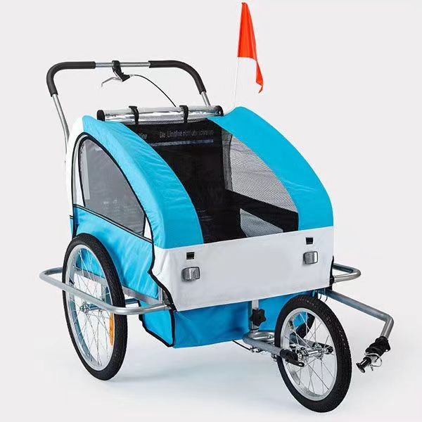 This image shows a contemporary child trailer with a striking color scheme of turquoise, white, and black. Designed for safe attachment to an electric motorcycle, it features robust wheels, a secure harness system inside, and a spacious interior. The trailer includes large mesh windows for visibility and air circulation, and a bright orange safety flag for enhanced visibility on the road. Perfect for active families looking to transport their children in comfort and style.