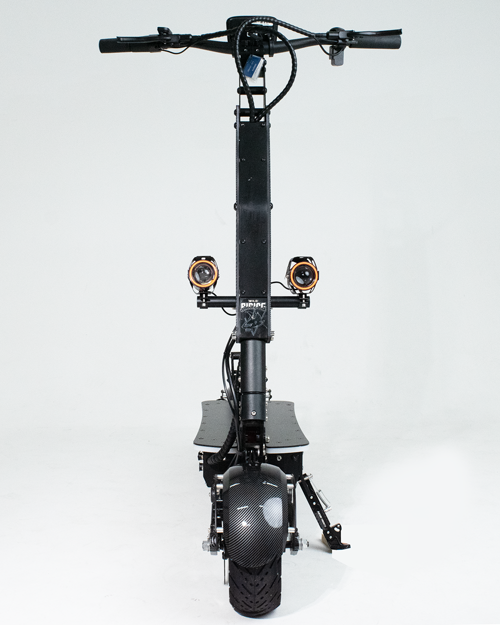 A front view of an electric scooter equipped with dual bright headlights, showcasing its modern design and advanced lighting system. The scooter is built for both urban commuting and off-road use.