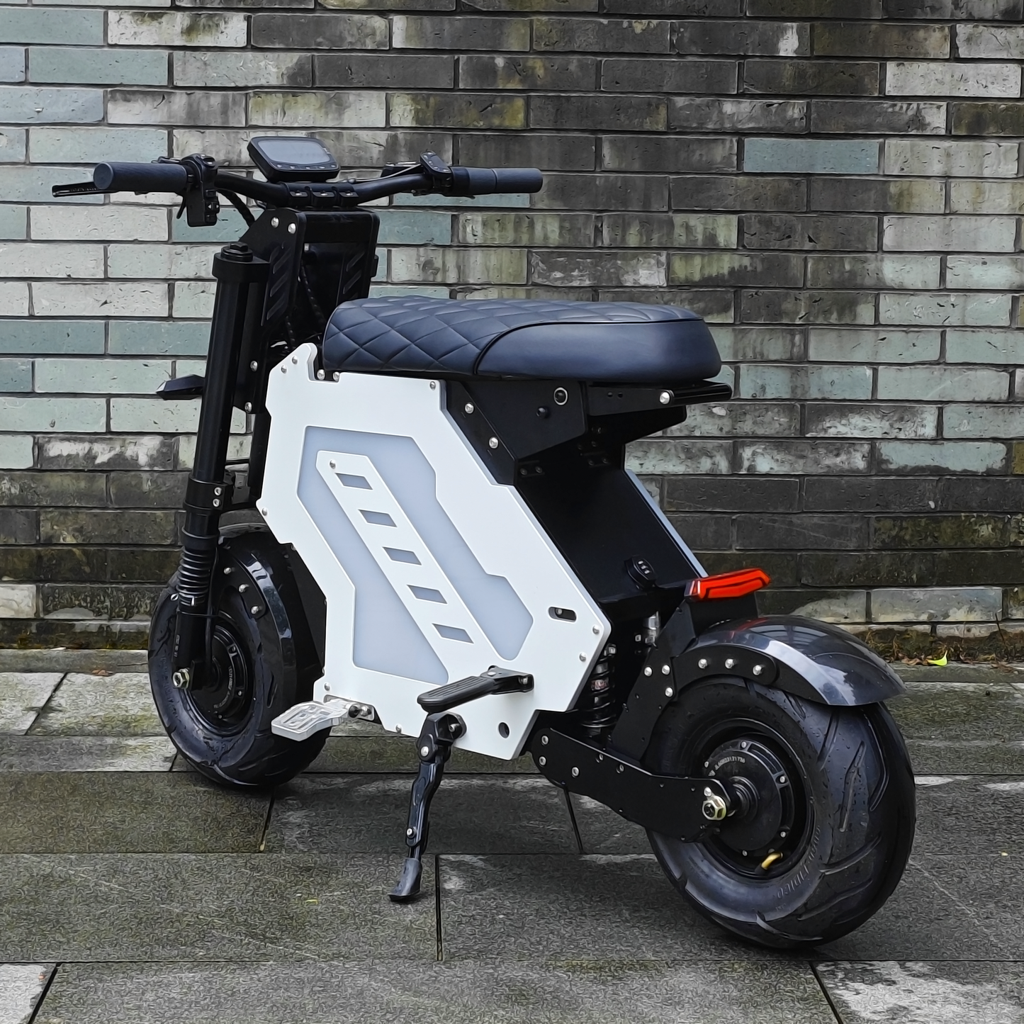Electric motorcycle shown in an urban environment, black and white design, suitable for city commuting